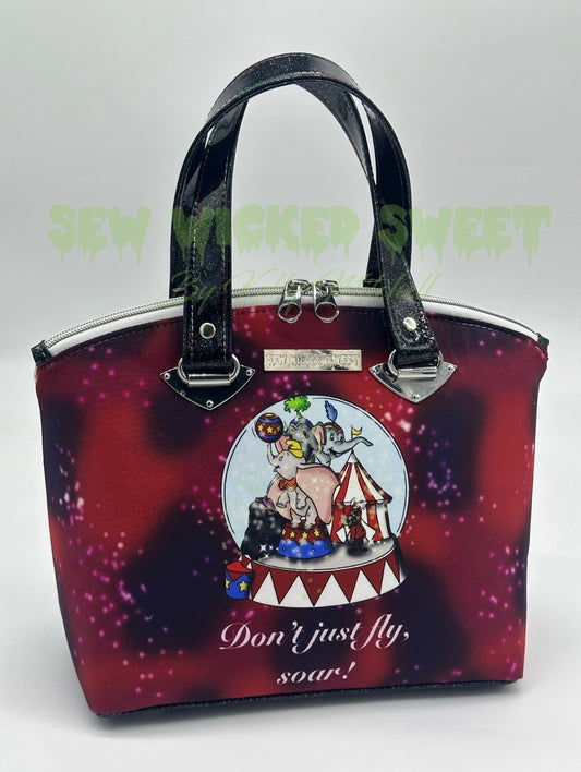 Flying elephant Christmas snow globe handbag